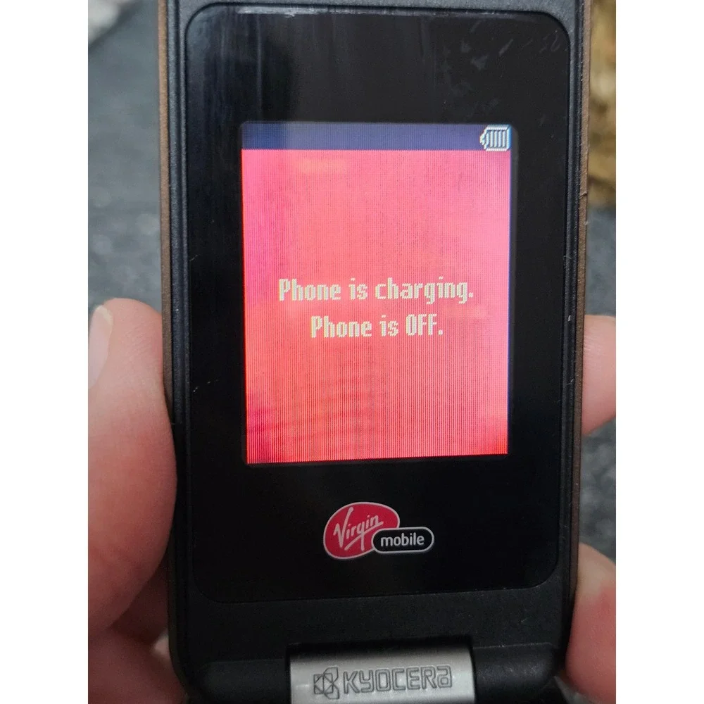 Kyocera flip phone branded for Virgin Mobile.